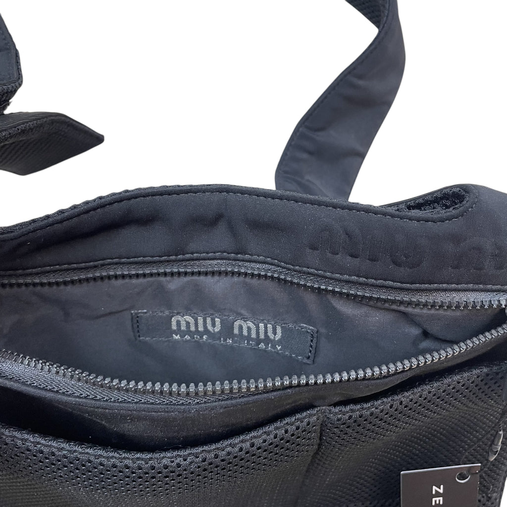 Zenno Archive Miu Miu SS1999 black mesh satchel bag featuring an interior logo tag and zip closure