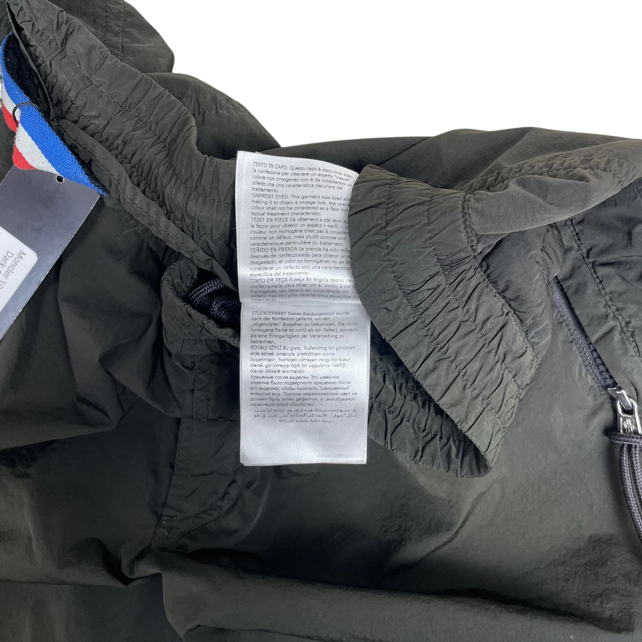 Zenno Archive Moncler 1952 dark green nylon pants featuring an elastic waistband and interior garment care label