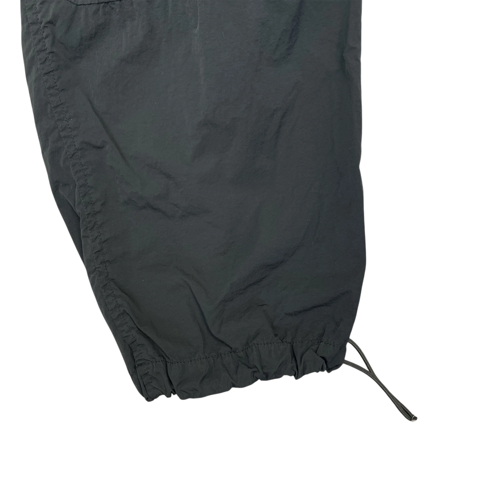 Zenno Archive Moncler 1952 dark green nylon pants featuring an adjustable drawstring hem detail.
