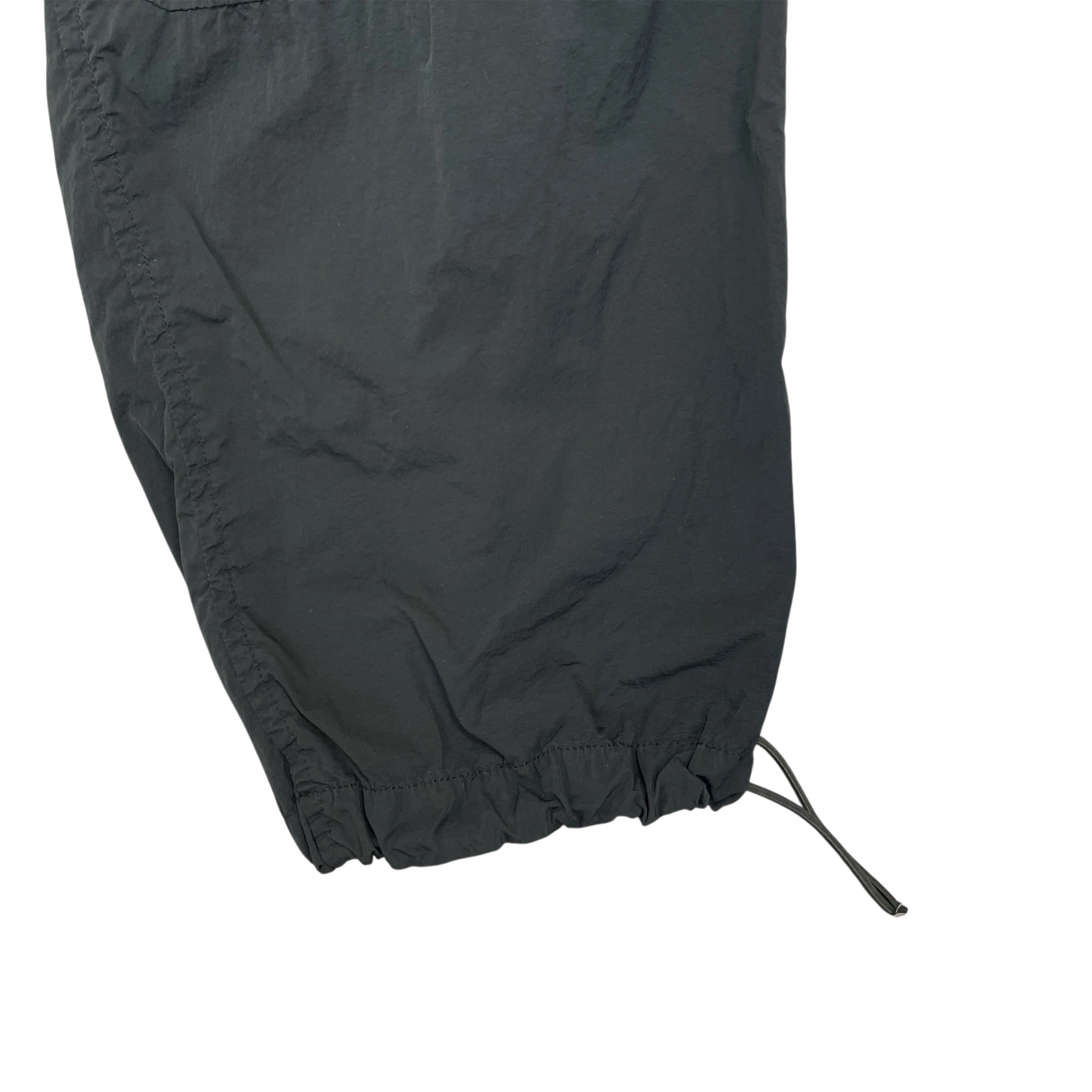 Zenno Archive Moncler 1952 dark green nylon pants featuring an adjustable drawstring hem detail.