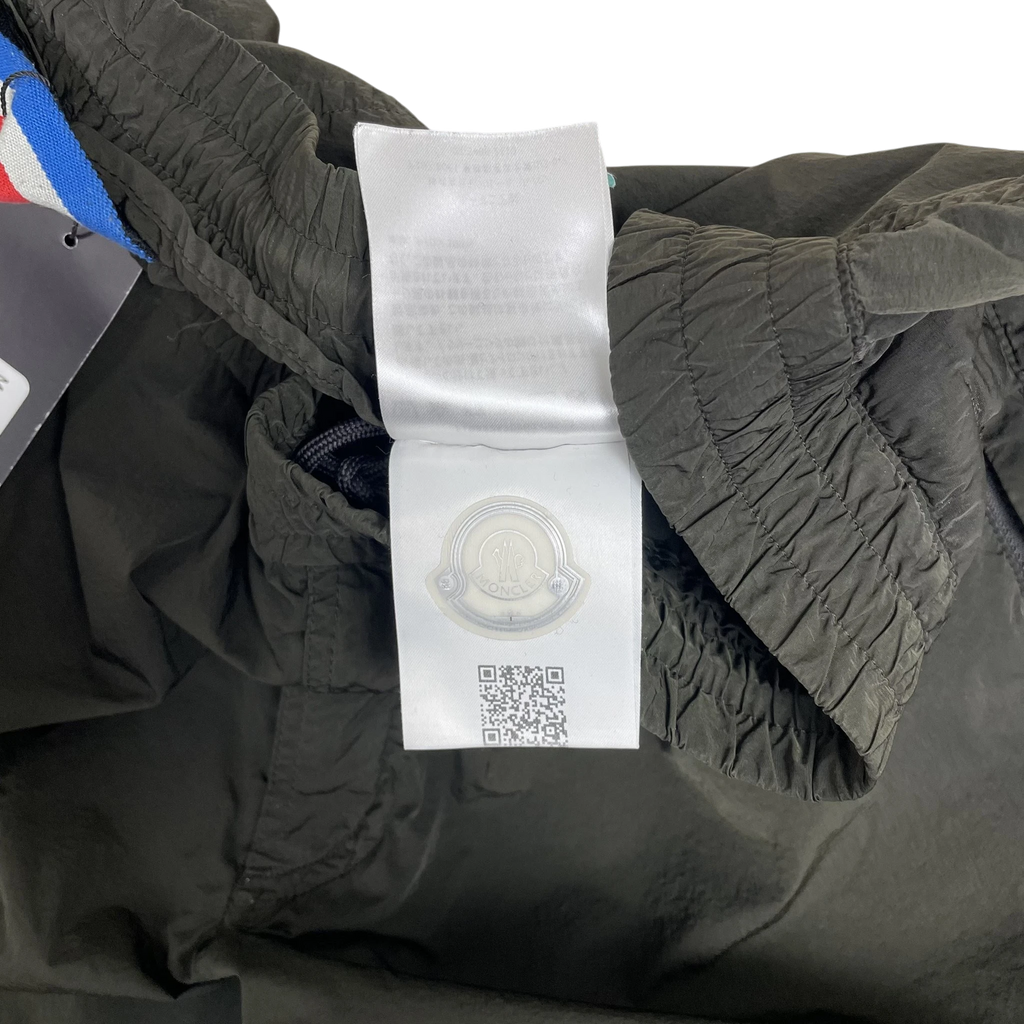 Zenno Archive Moncler 1952 dark green nylon pants featuring an authentic interior brand label and QR code tag