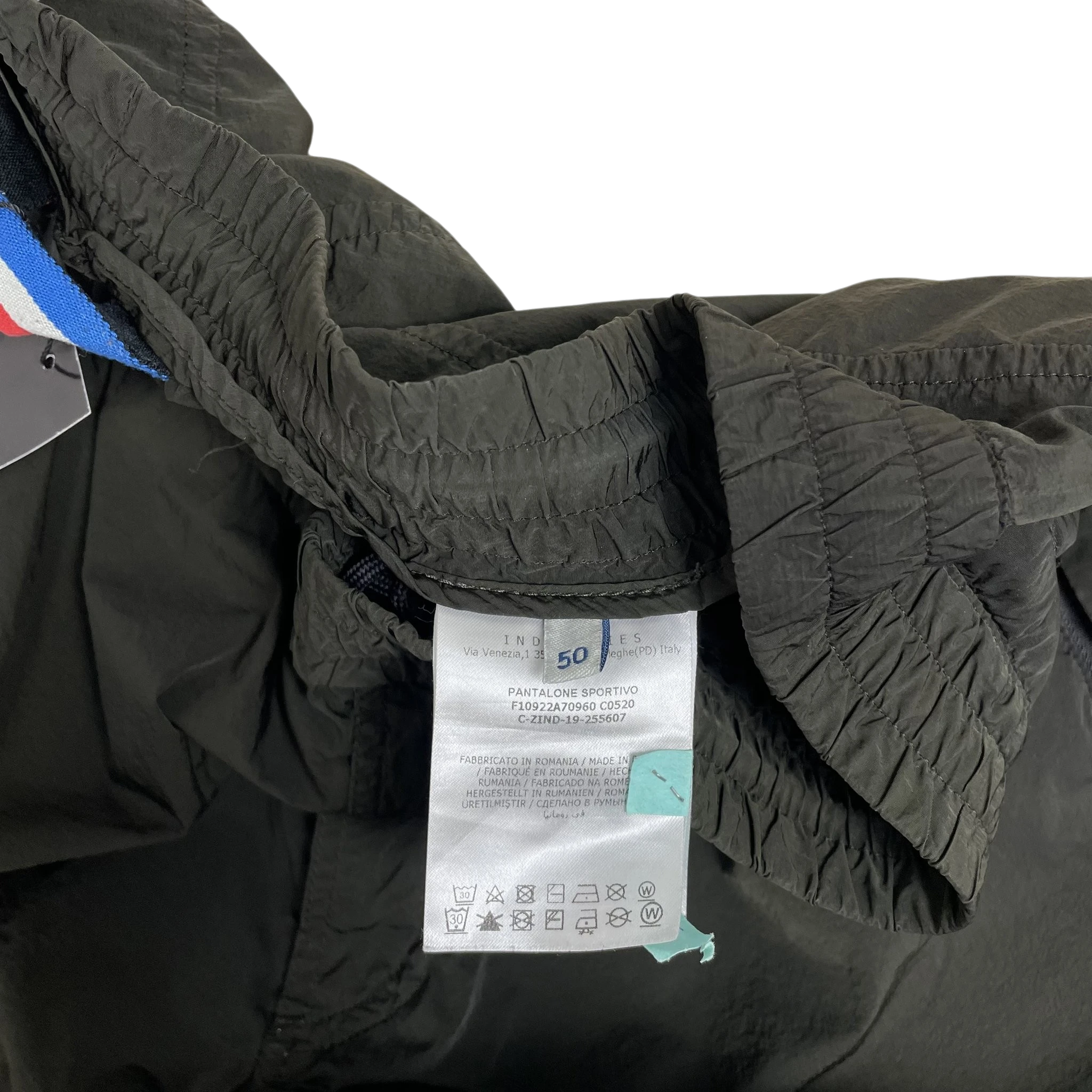 Zenno Archive Moncler 1952 dark green nylon pants interior label showing size 50 and care instructions