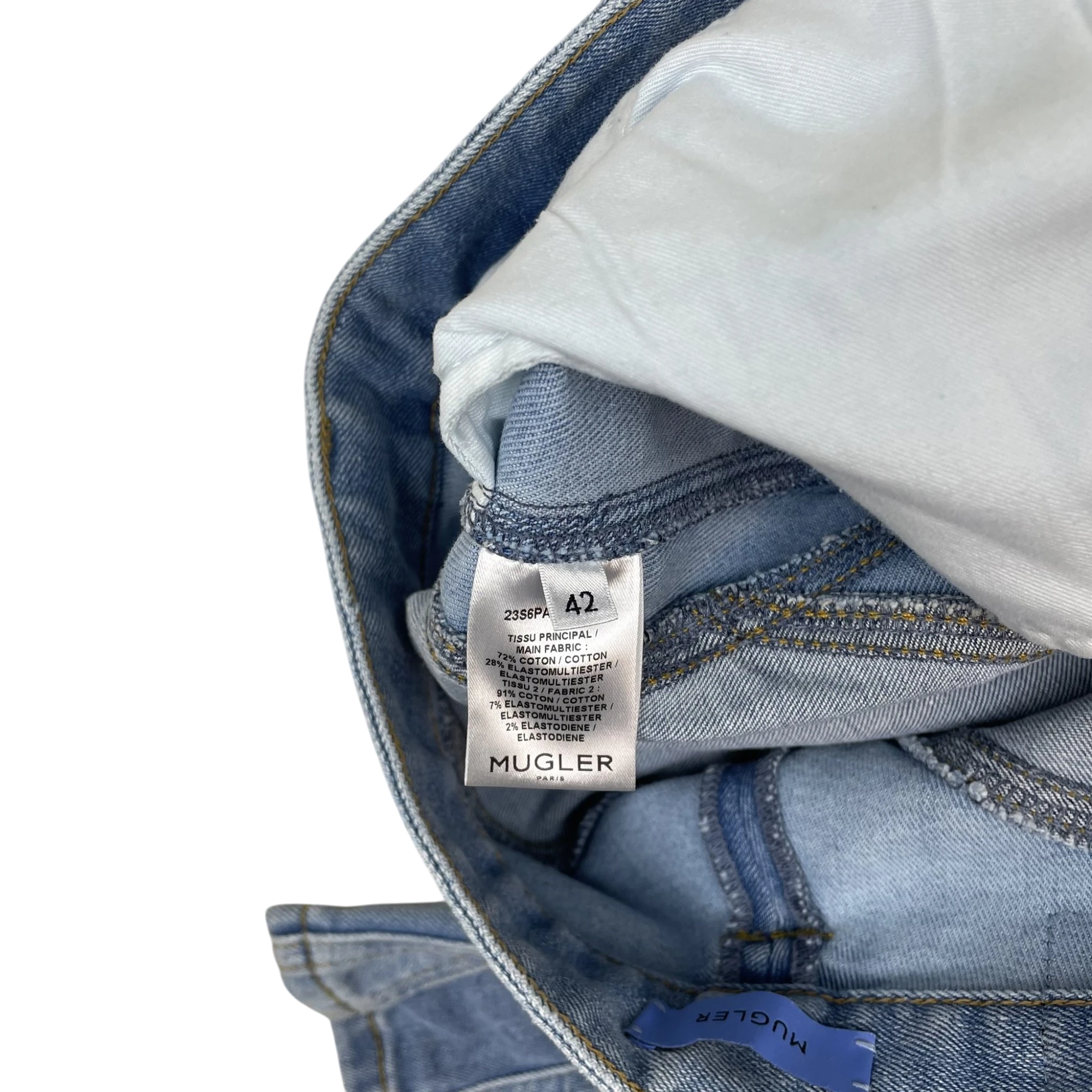 Zenno Archive Mugler spiral jeans interior label showing fabric composition and size 42 in light blue denim