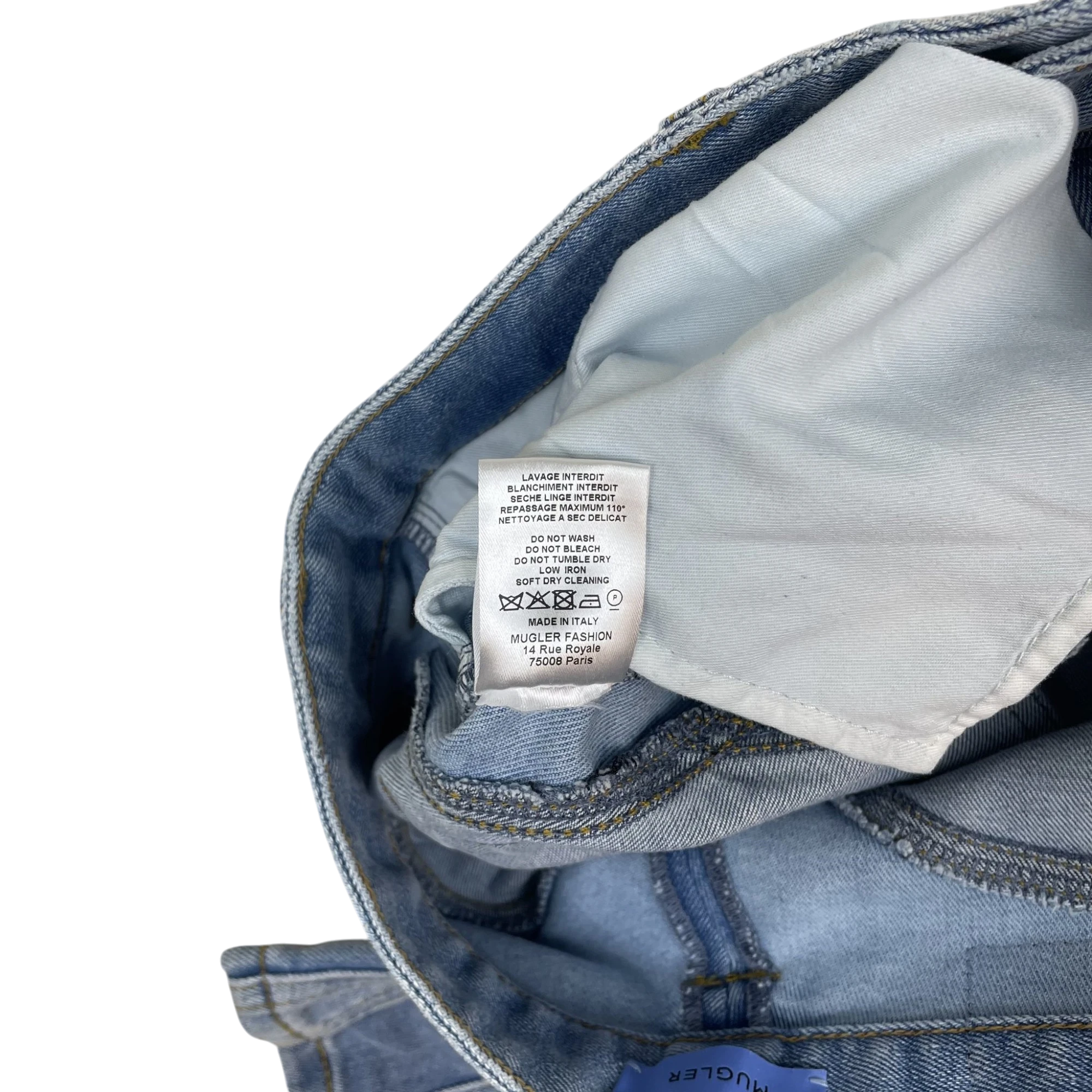 Zenno Archive Mugler Spiral jeans care label showing washing instructions and Made in Italy origin on light blue denim