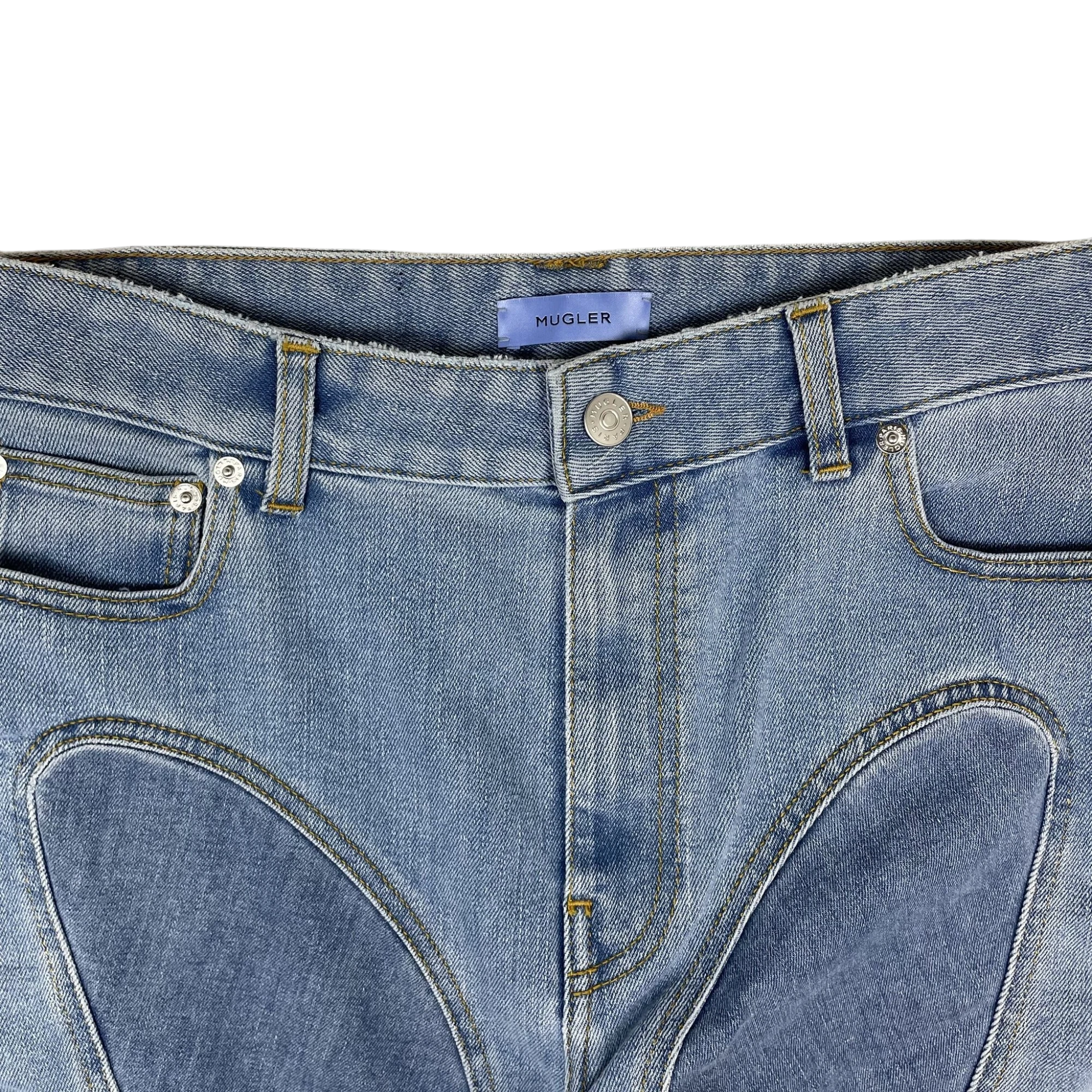 Zenno Archive Mugler light blue denim jeans featuring signature spiral panel construction and branded button detail.