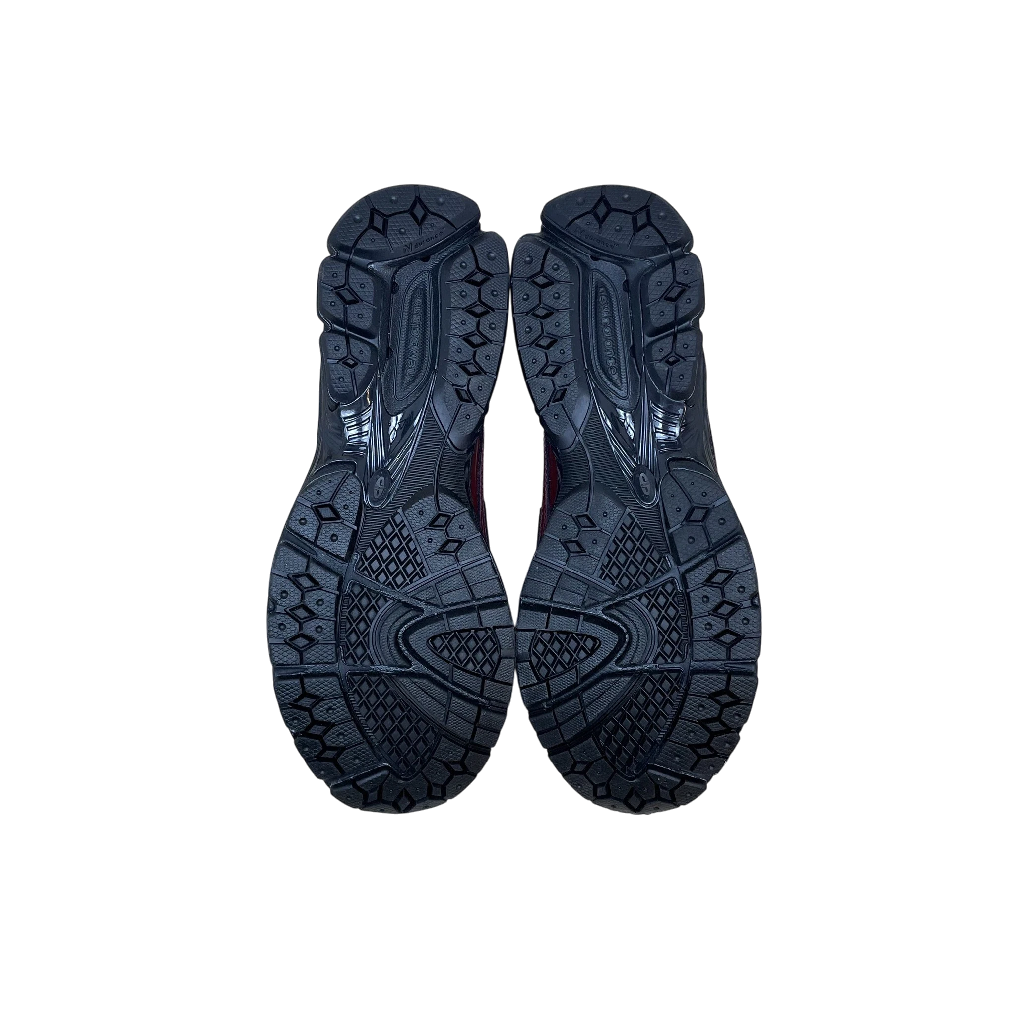 Zenno Archive New Balance 1906L maroon crocodile loafers showing the black rubber outsoles from a bottom view