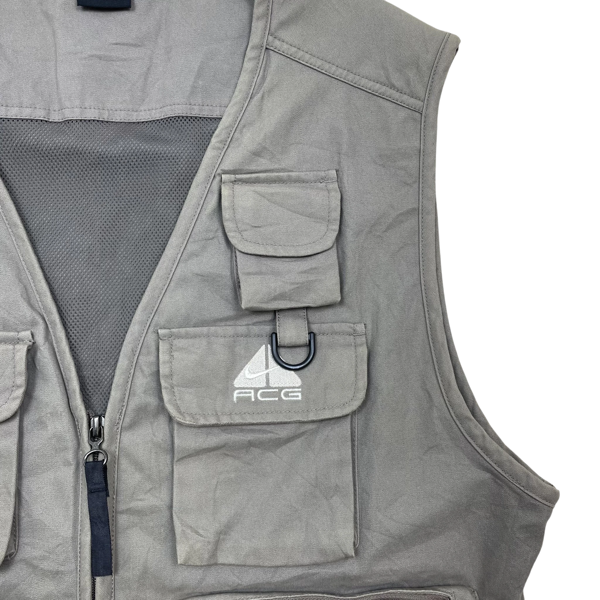 Zenno Archive Nike ACG 90s tactical vest in brown featuring multiple utility pockets and a D-ring attachment.