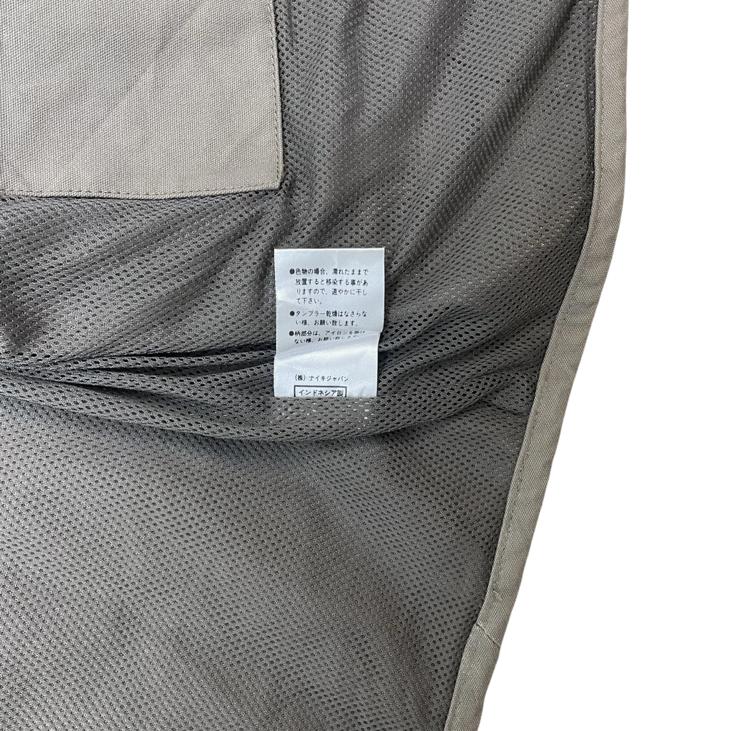 Zenno Archive Nike ACG 90s tactical vest interior showing brown mesh lining and Japanese care label
