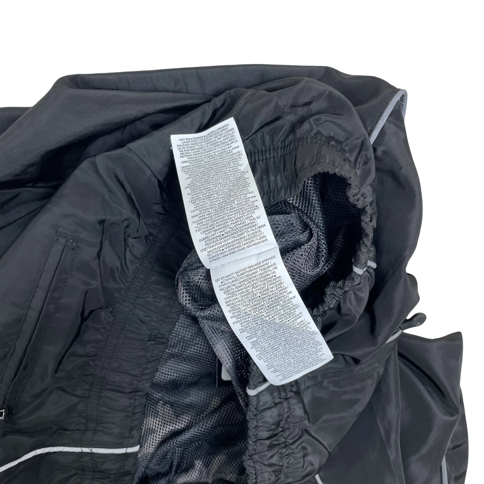 Zenno Archive Nike x Corteiz black track pants interior care label and mesh lining detail