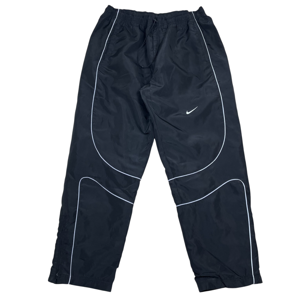 Zenno Archive black Nike x Corteiz track pants with white 3M reflective piping and elastic drawstring waist