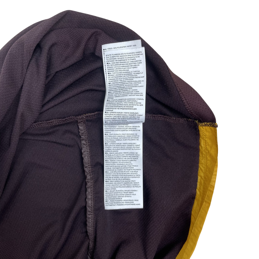 Zenno Archive Nike x Undercover Gyakusou jacket interior care label with burgundy and yellow fabric details