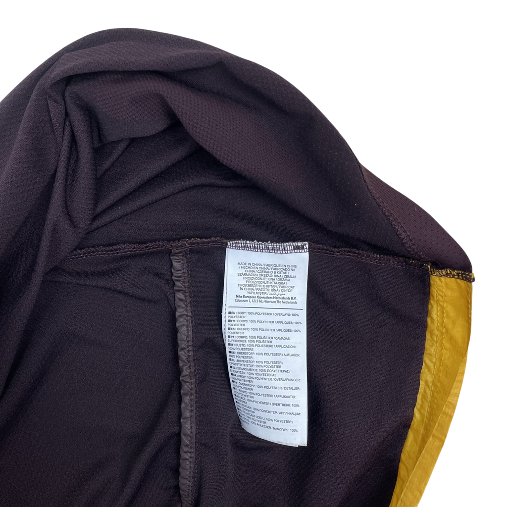 Zenno Archive Nike x Undercover Gyakusou jacket interior care label showing 100 percent polyester composition