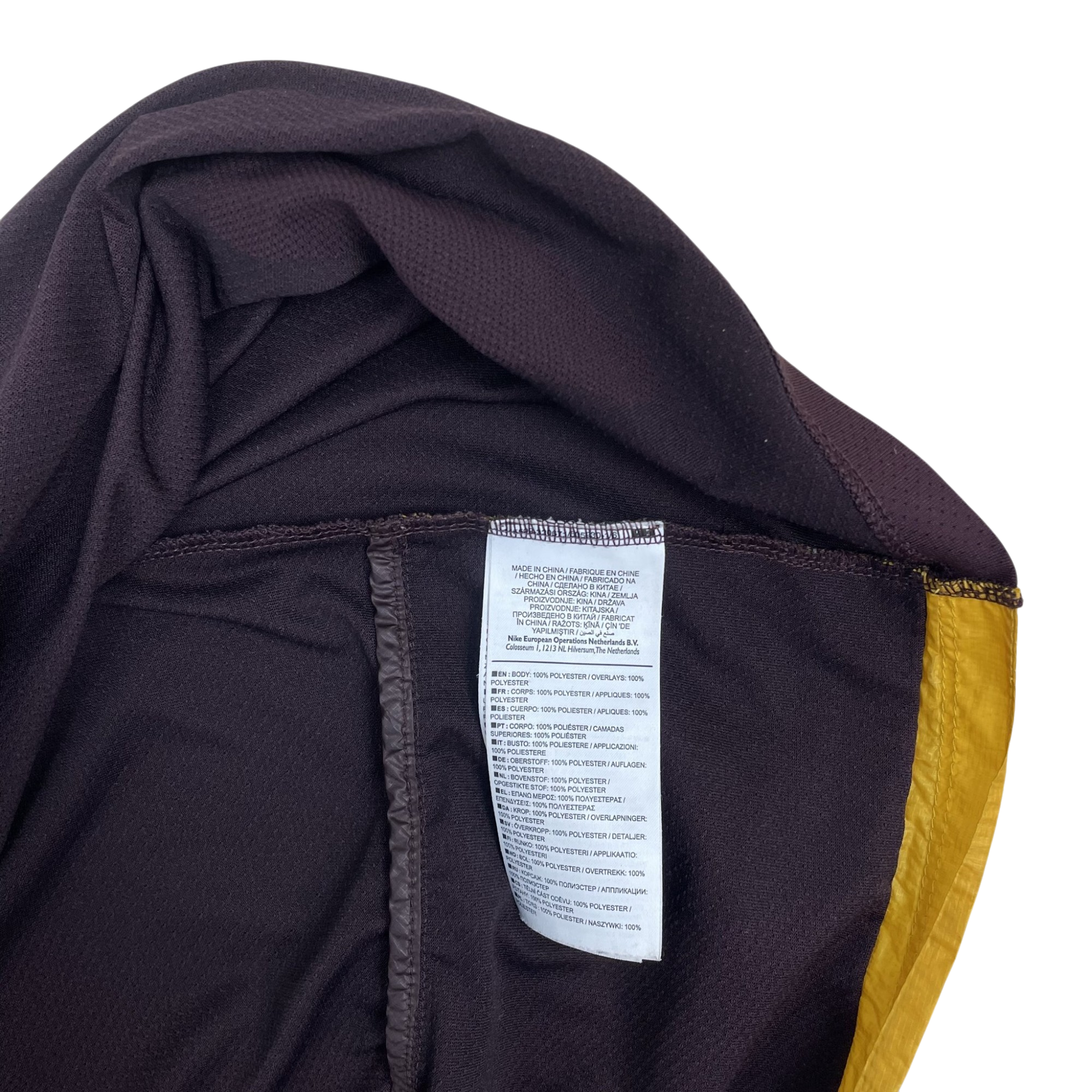Zenno Archive Nike x Undercover Gyakusou jacket interior care label showing 100 percent polyester composition