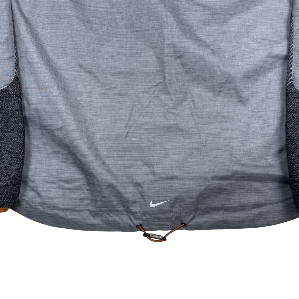 Zenno Archive Nike x Undercover Gyakusou grey technical running jacket with drawstring hem and white swoosh logo