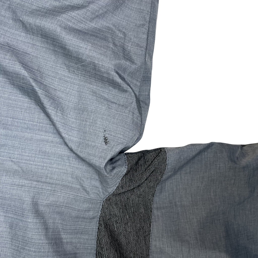 Zenno Archive Nike x Undercover Gyakusou grey technical running jacket showing fabric detail and small defect