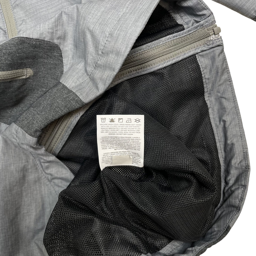 Zenno Archive Nike x Undercover Gyakusou technical jacket interior with grey fabric and black mesh lining care label