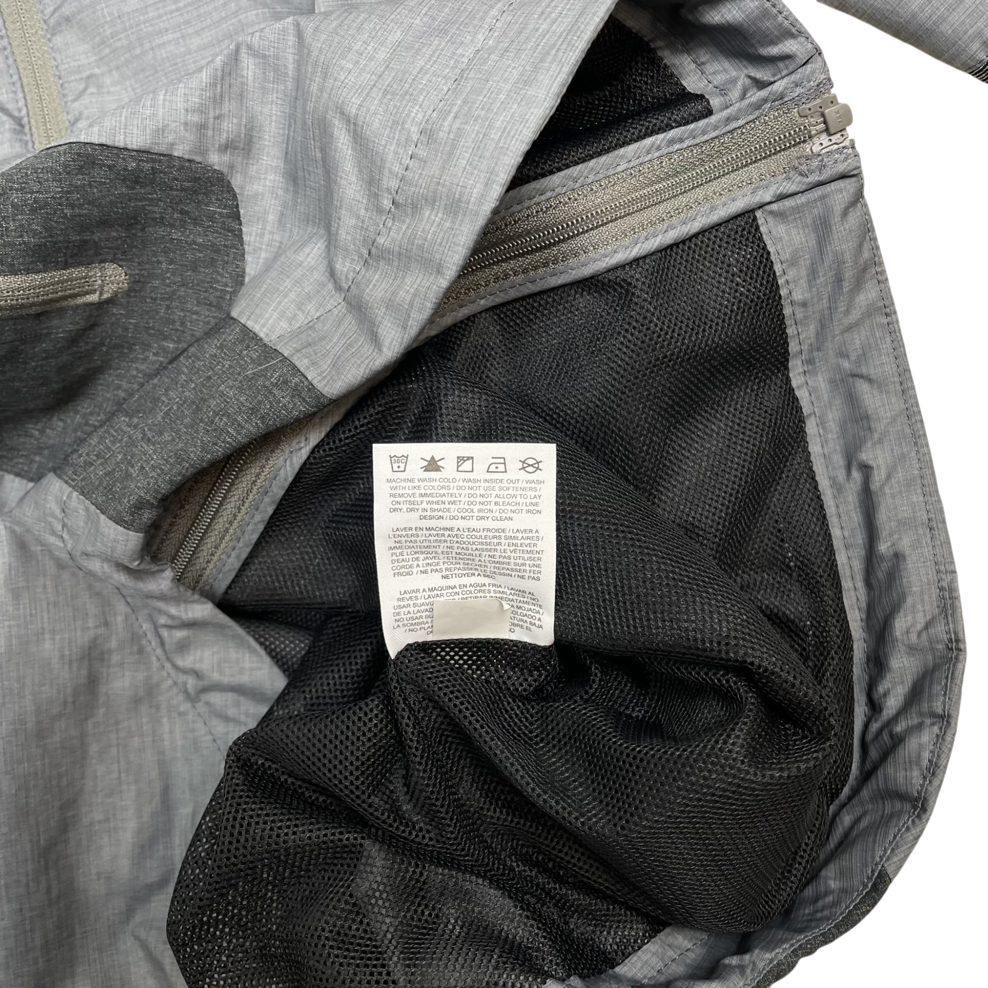 Zenno Archive Nike x Undercover Gyakusou technical jacket interior with grey fabric and black mesh lining care label