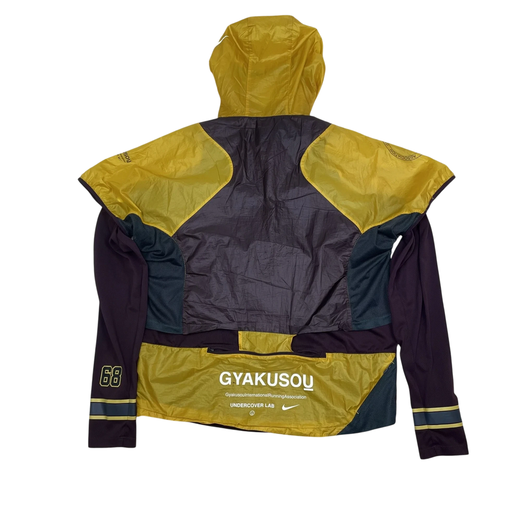 Zenno Archive Nike x Undercover Gyakusou SS19 transform jacket in burgundy and yellow with back branding and hood.