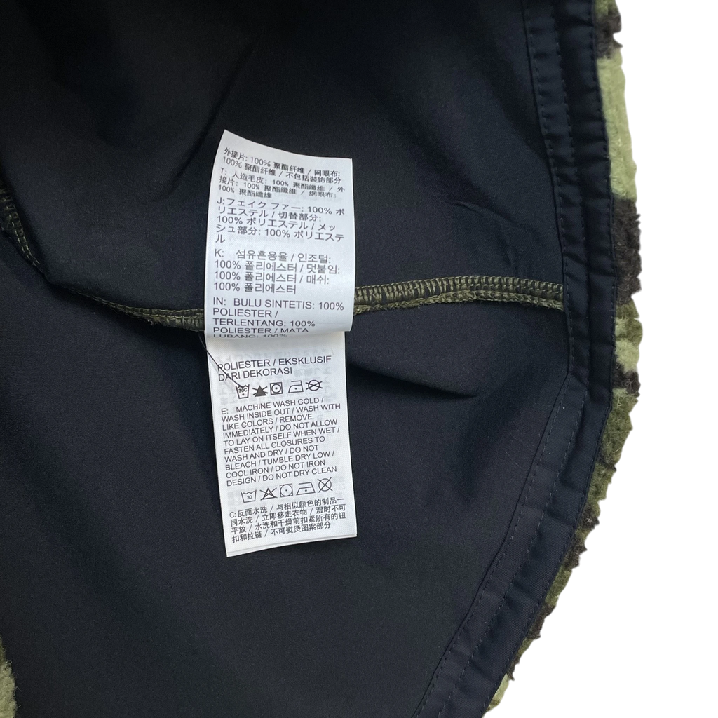 Zenno Archive Nike x MMW fleece jacket interior care label with washing instructions in multiple languages