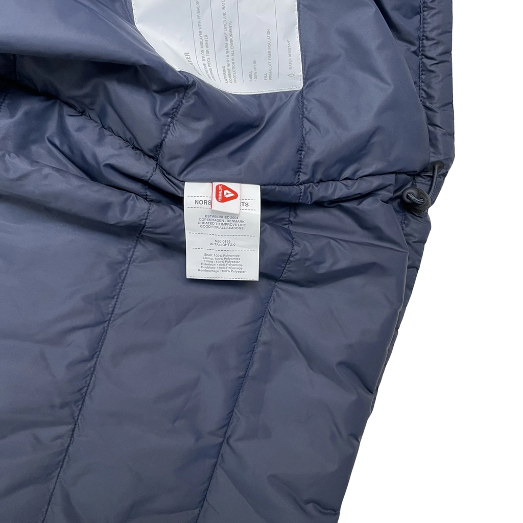Zenno Archive Norse Projects navy insulated waterproof jacket interior label with Primaloft insulation details