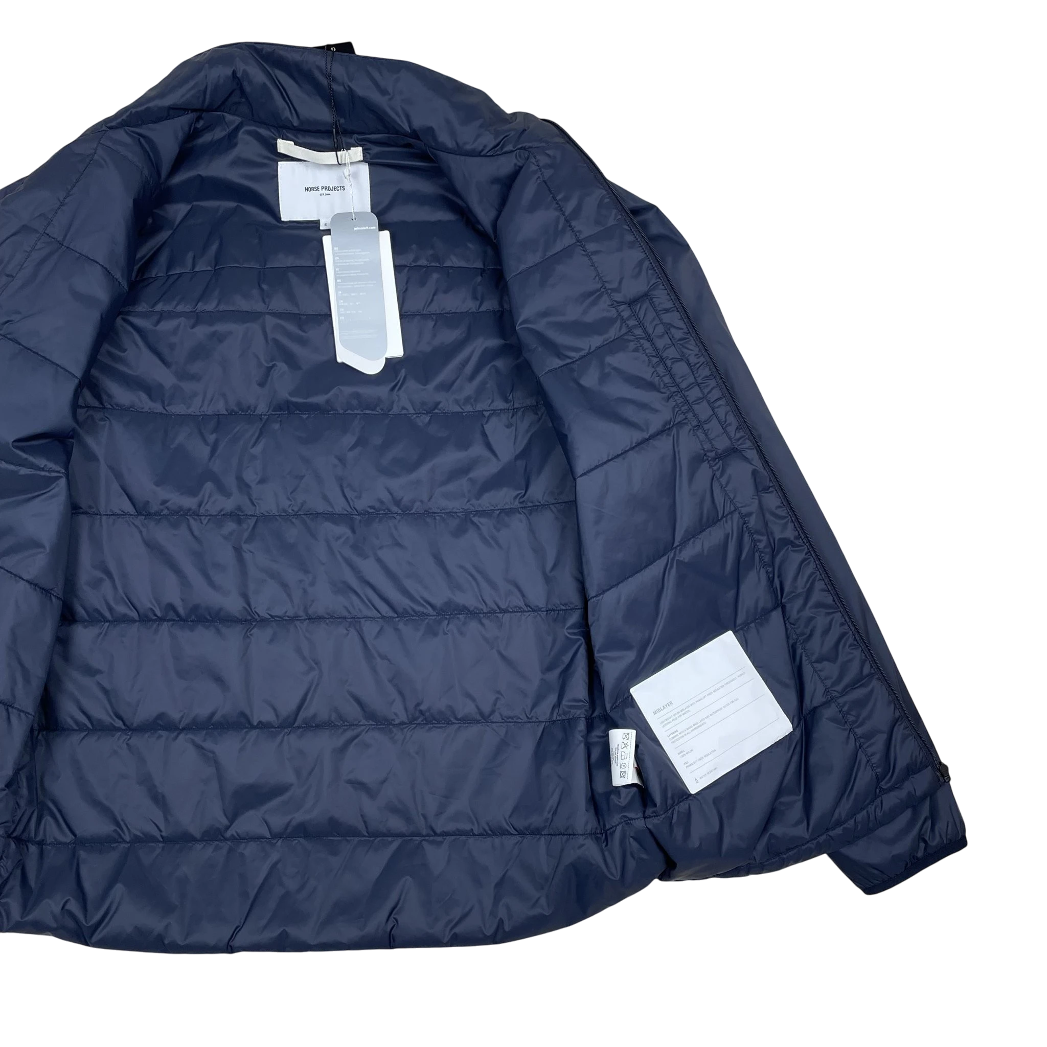 Zenno Archive Norse Projects navy blue insulated waterproof jacket interior view with tags attached