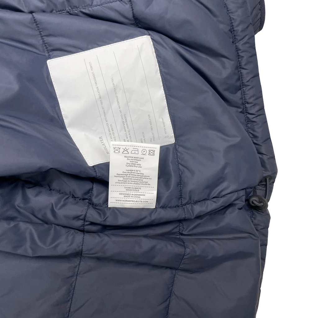 Zenno Archive Norse Projects navy insulated waterproof jacket interior care label and Primaloft insulation tag