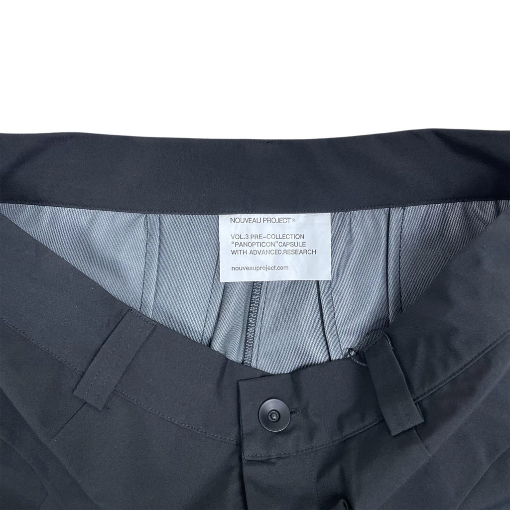 Zenno Archive Nouveau Project technical trousers featuring a black waistband and interior branding label