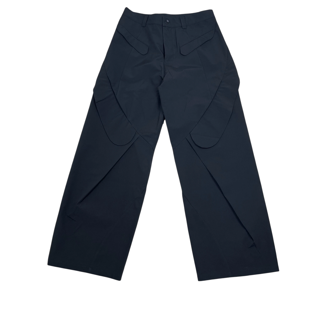 Zenno Archive Nouveou Project black technical trousers featuring unique flap pocket detailing and a wide-leg silhouette.