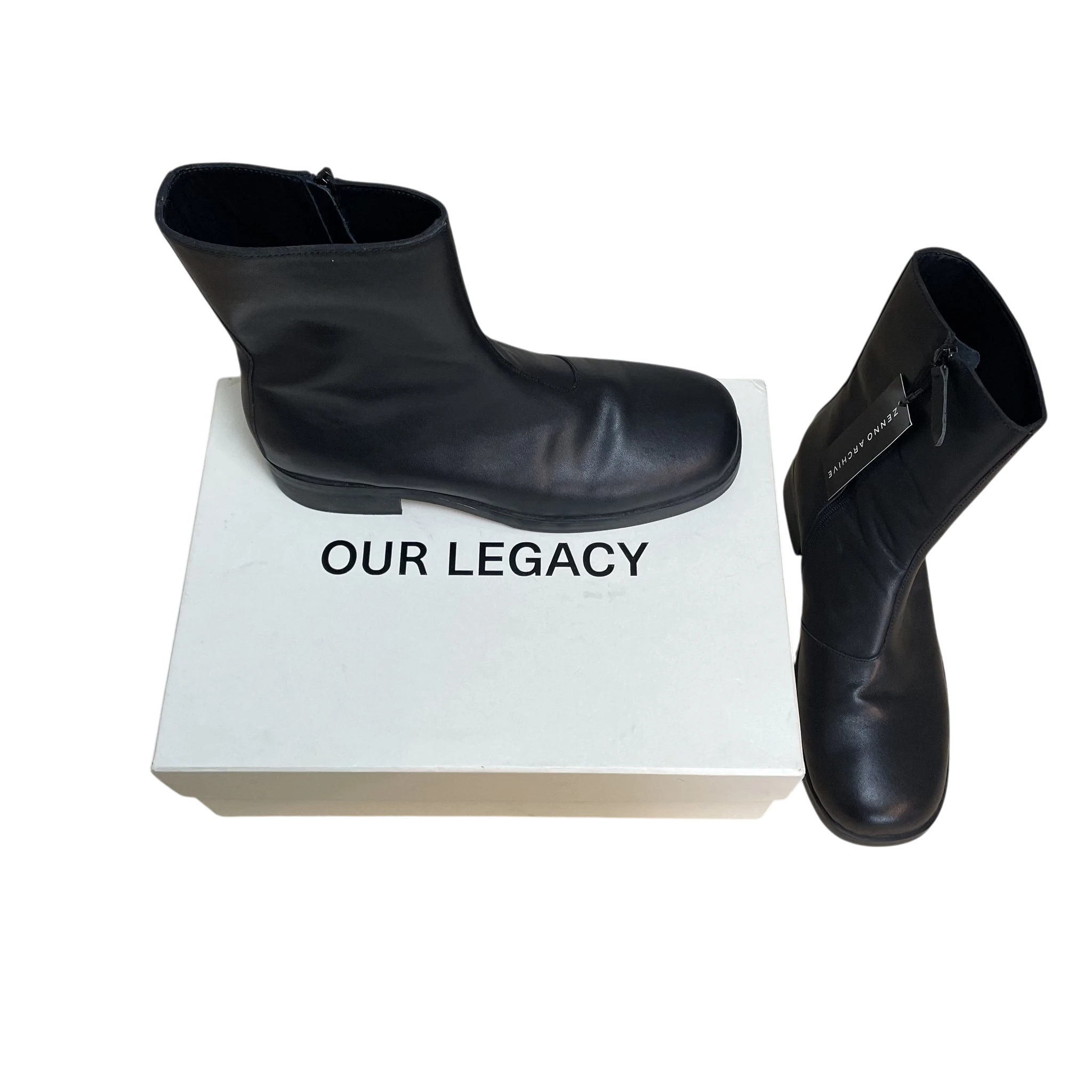 Zenno Archive Our Legacy black leather Camion boots with side zip closure displayed with original white shoe box