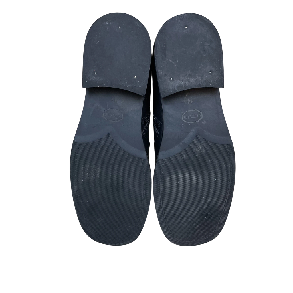 Zenno Archive Our Legacy Camion black leather boots showing the durable Vibram rubber outsoles