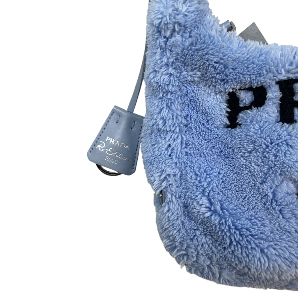 Zenno Archive Prada Re-Edition 2000 mini bag in baby blue terry cloth with matching leather key ring detail