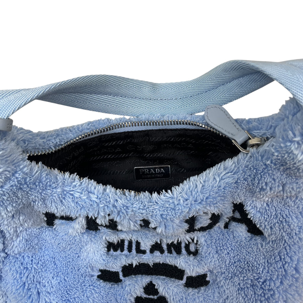 Zenno Archive Prada Re-Edition 2000 mini bag in baby blue terry cloth with black logo embroidery and zip closure