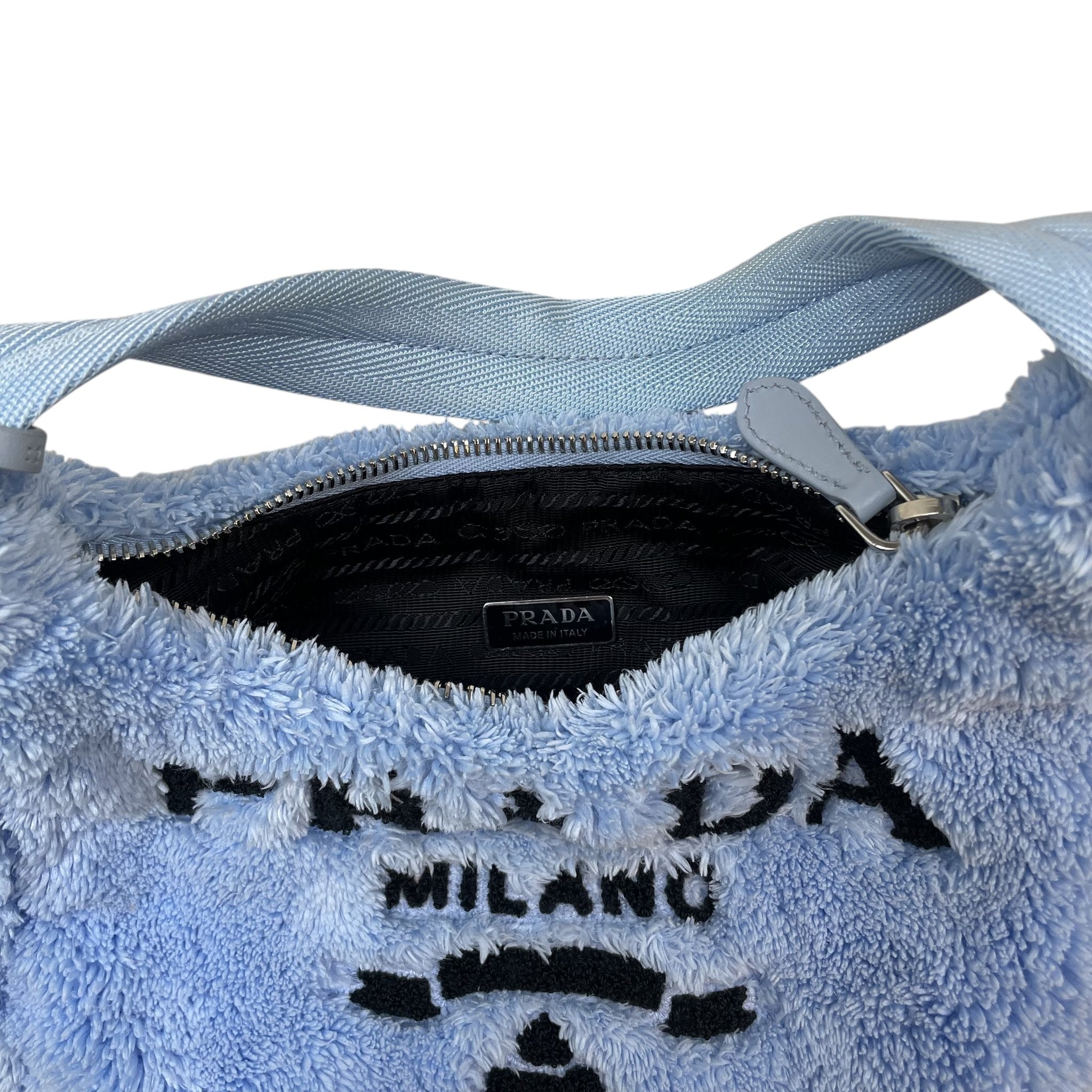 Zenno Archive Prada Re-Edition 2000 mini bag in baby blue terry cloth with black logo embroidery and zip closure