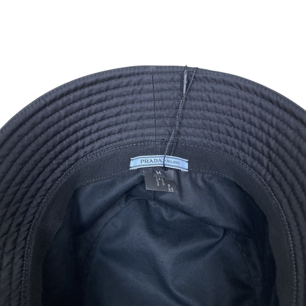 Zenno Archive Prada black nylon bucket hat interior view showing size M label and brand tag