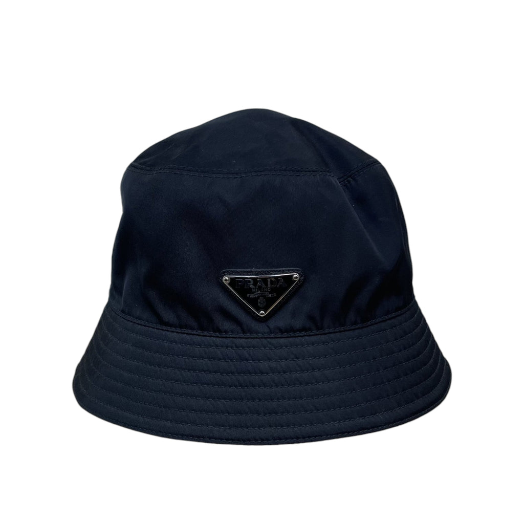 Zenno Archive black Prada nylon bucket hat featuring the iconic triangle logo plaque on the front