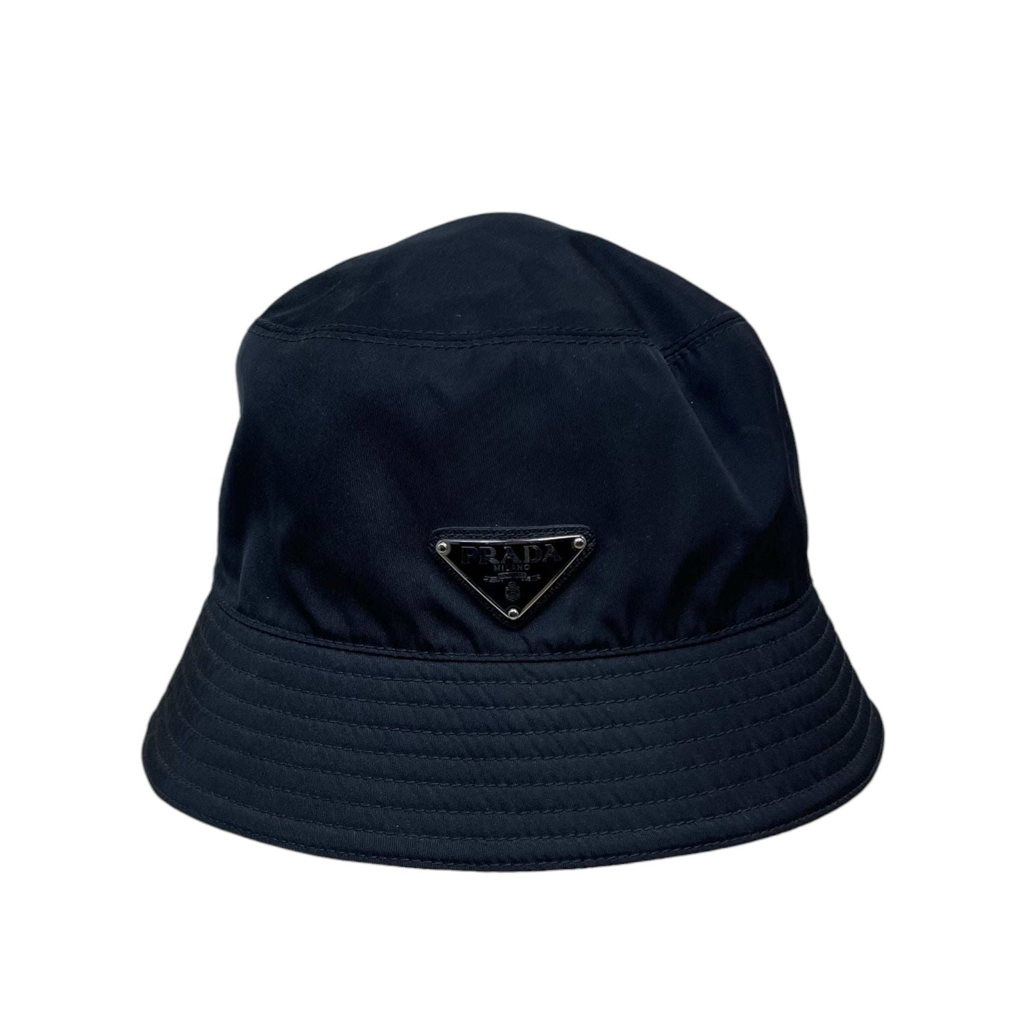 Zenno Archive black Prada nylon bucket hat featuring the iconic triangle logo plaque on the front