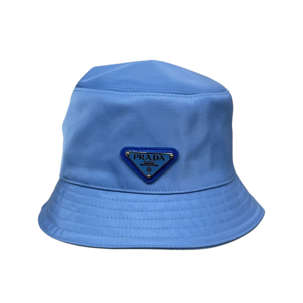 Zenno Archive baby blue Prada nylon bucket hat featuring the iconic triangle logo plaque on the front.