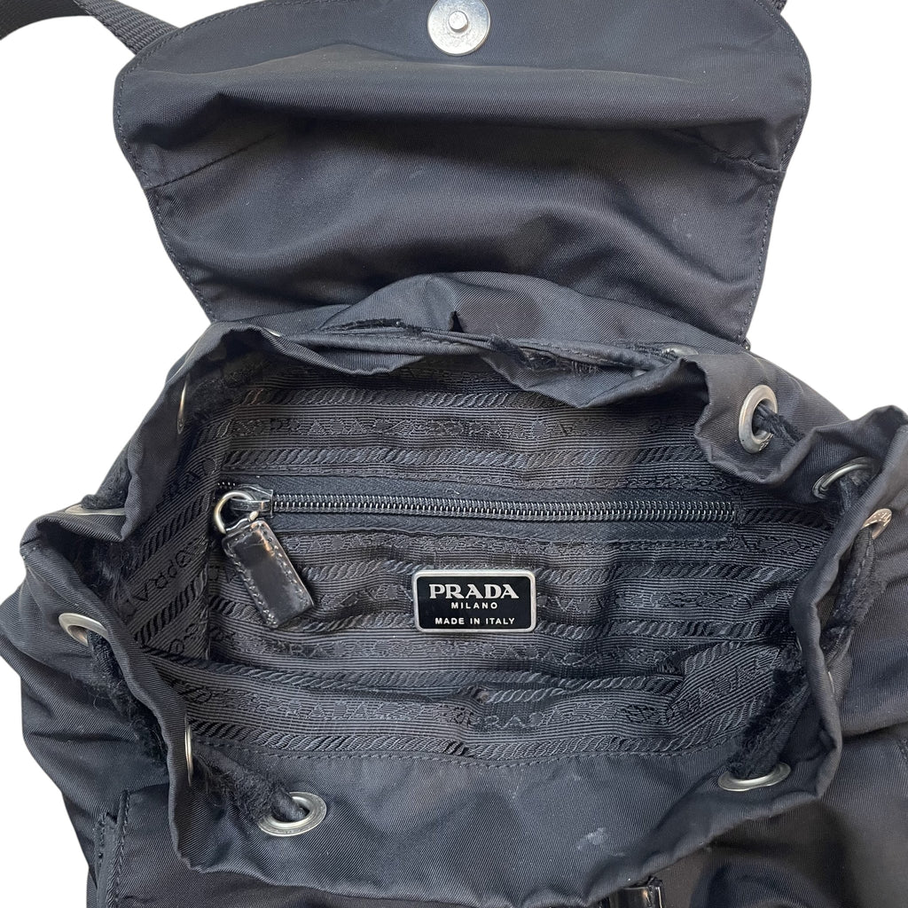 Zenno Archive Prada Tessuto Montagna black nylon backpack interior view with branded lining and metal logo plaque