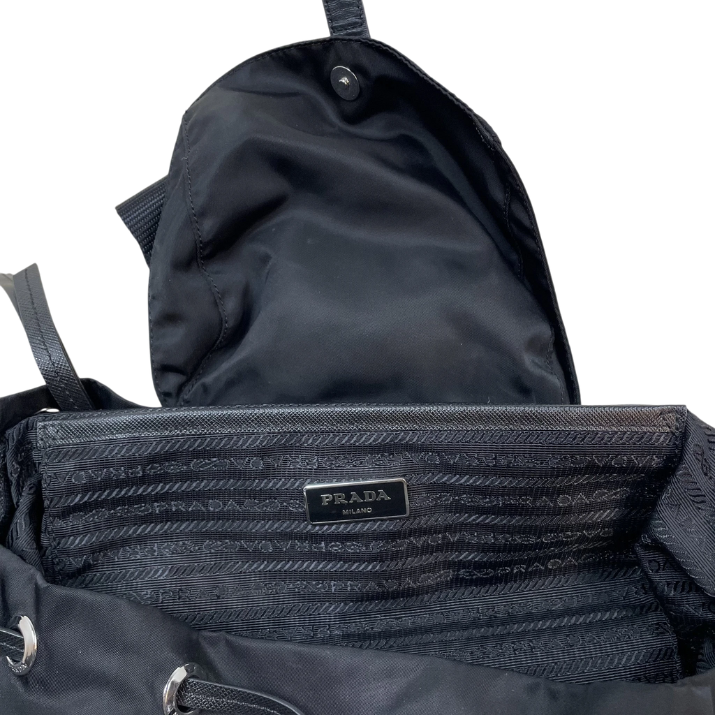 Zenno Archive Prada black nylon backpack interior with branded lining and metal logo plaque
