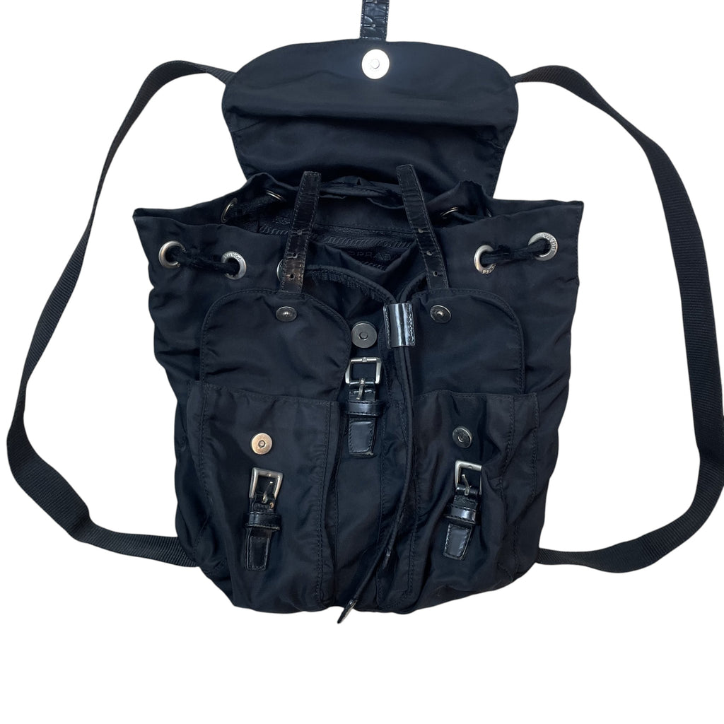 Zenno Archive black Prada Tessuto Montagna nylon backpack with front pockets, buckle closures, and drawstring top.