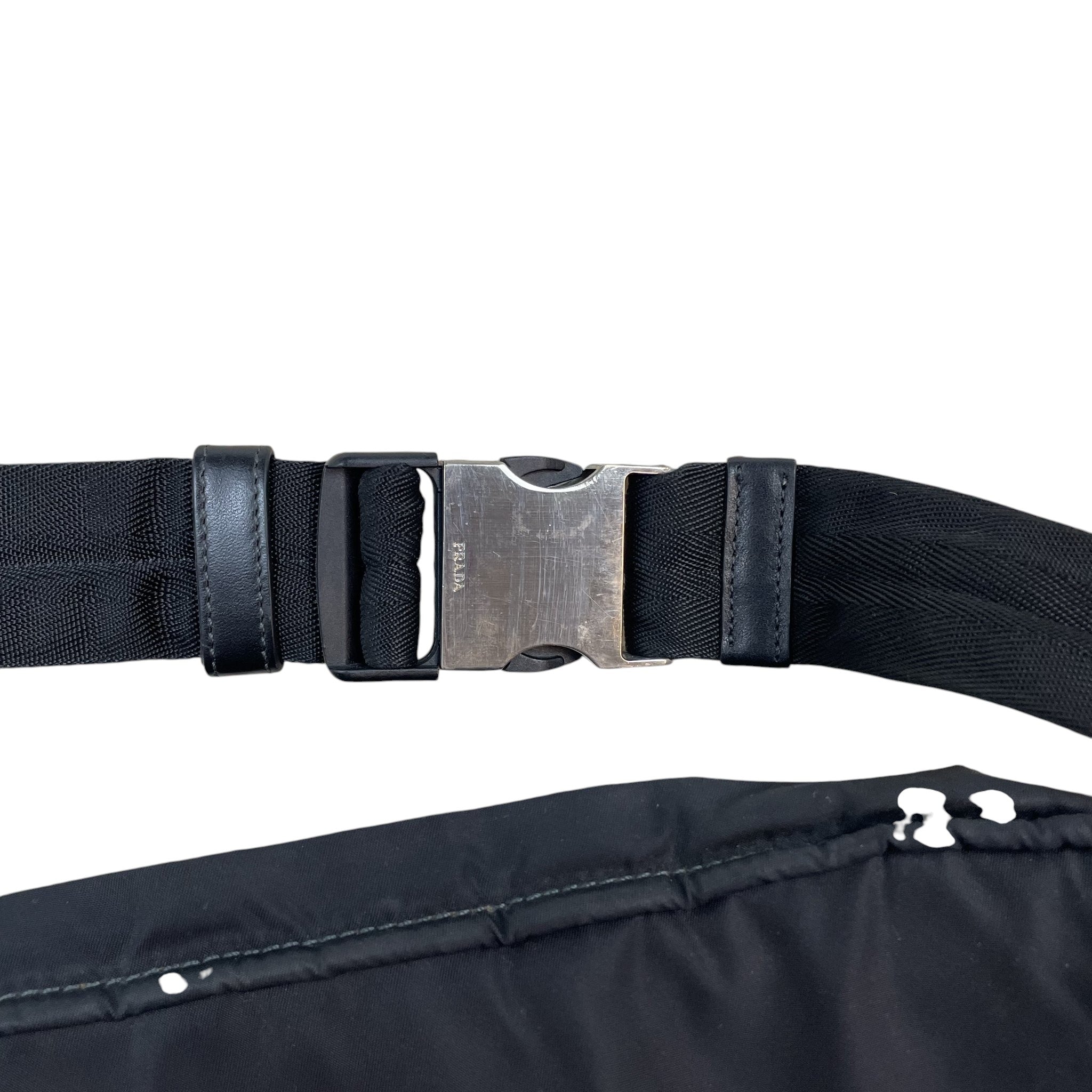 Zenno Archive Prada SS18 black nylon belt bag featuring a silver metal buckle with engraved Prada logo