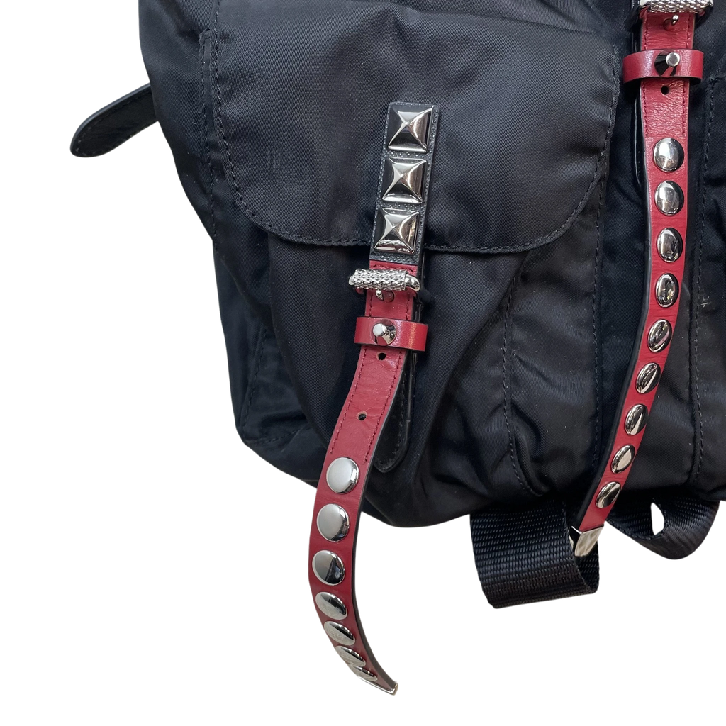 Zenno Archive Prada black nylon backpack featuring red leather straps with silver pyramid and round metal studs