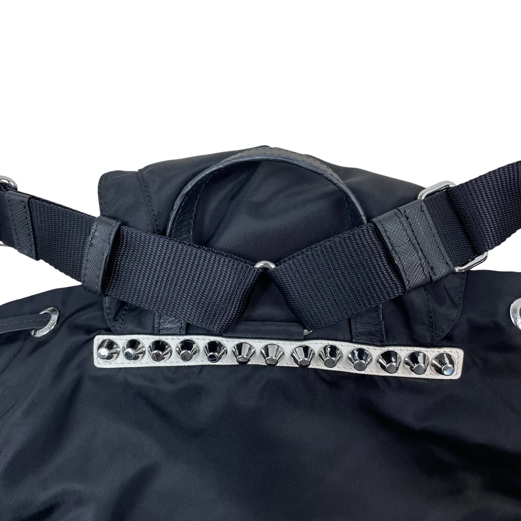Zenno Archive Prada black nylon backpack featuring a white leather trim with silver-tone metal stud embellishments.
