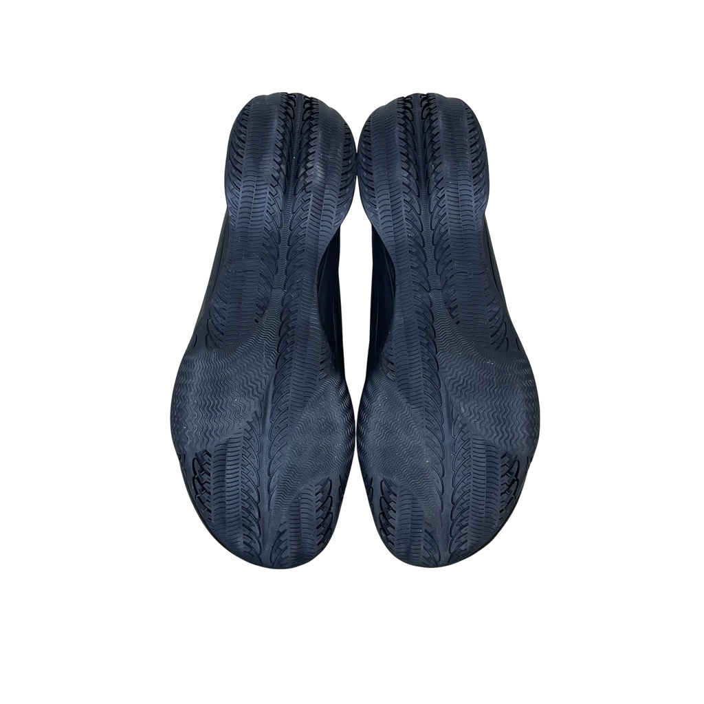 Zenno Archive Puma x Rombaut Levitation sneakers in black, showing the textured rubber outsoles from a bottom view.