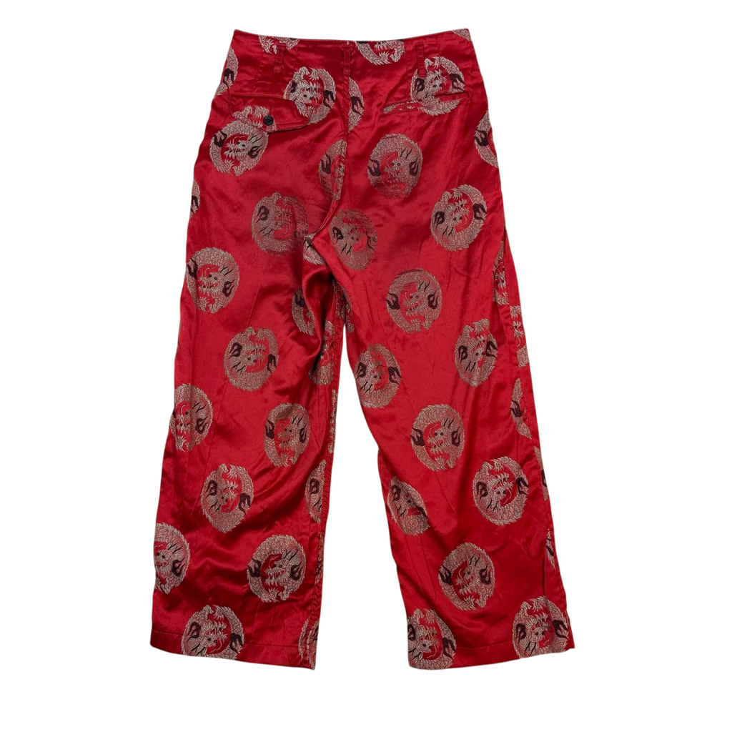 Zenno Archive Comme Des Garçons Homme Plus red satin pants featuring an intricate embroidered dragon print pattern.