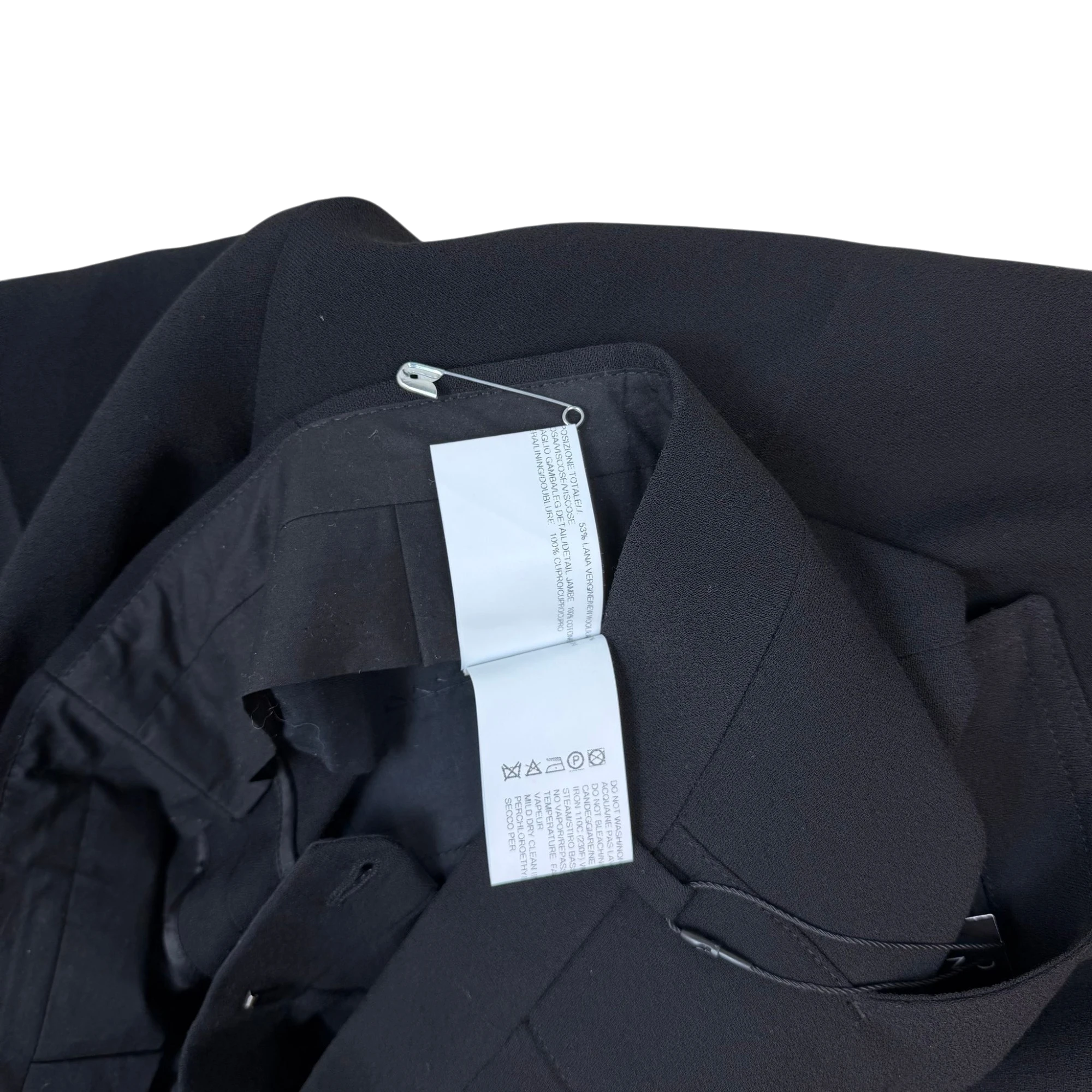 Zenno Archive Rick Owens black wool harness trousers featuring interior care labels and a silver safety pin detail