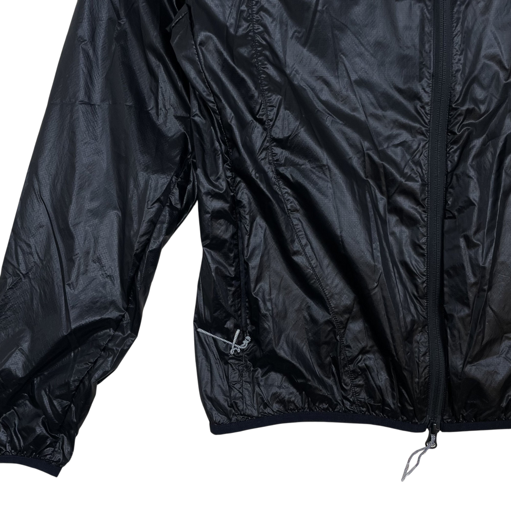 Zenno Archive ROA Hue packable black wind jacket featuring lightweight ripstop nylon and a front zip closure
