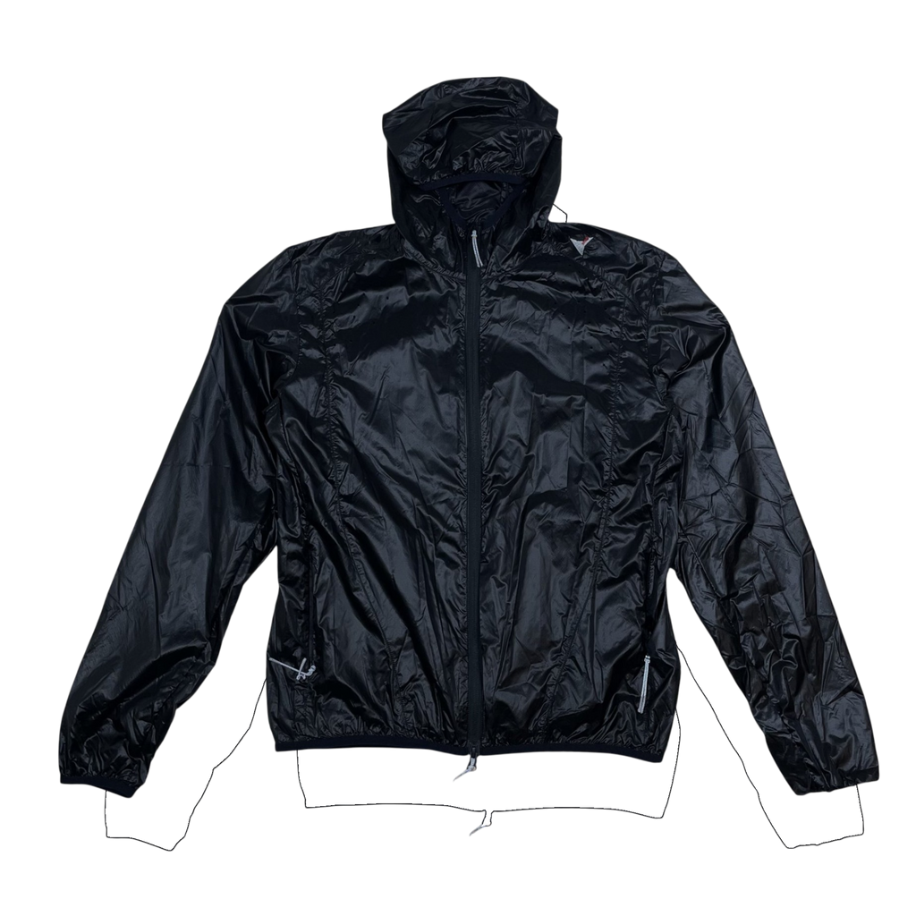 Zenno Archive ROA Hue black packable wind jacket with a hood and full zip closure, laid flat on a textured surface.