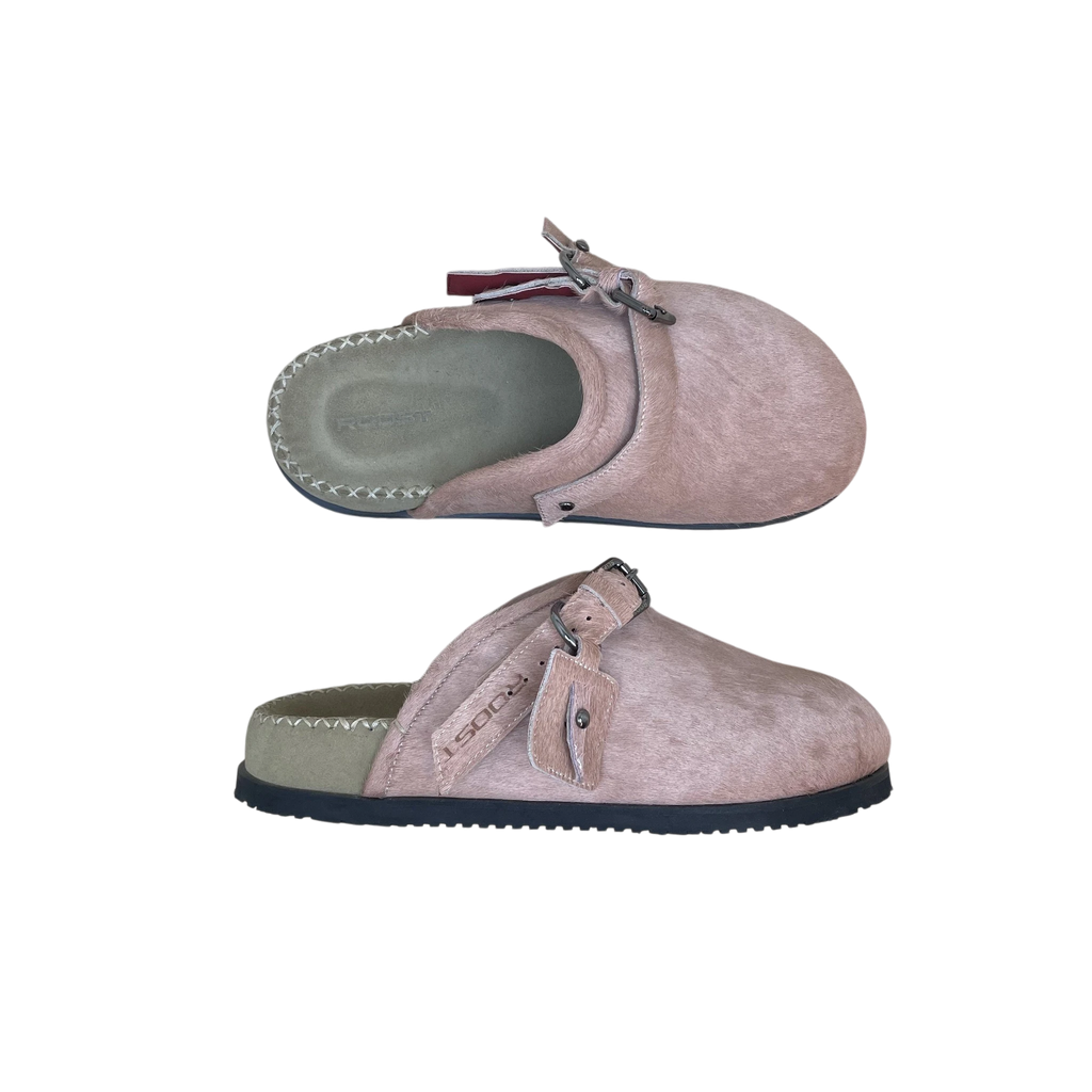 Zenno Archive Roost pink cowhide slippers with buckle strap detail and stitched footbed on a textured surface