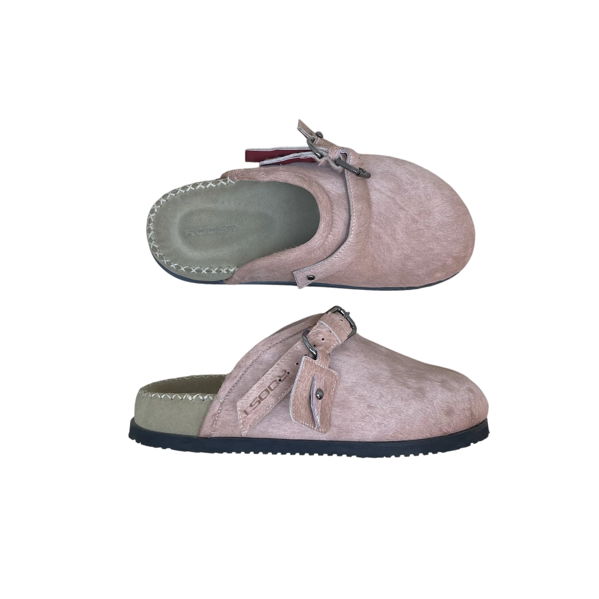 Zenno Archive Roost pink cowhide slippers with buckle strap detail and stitched footbed on a textured surface